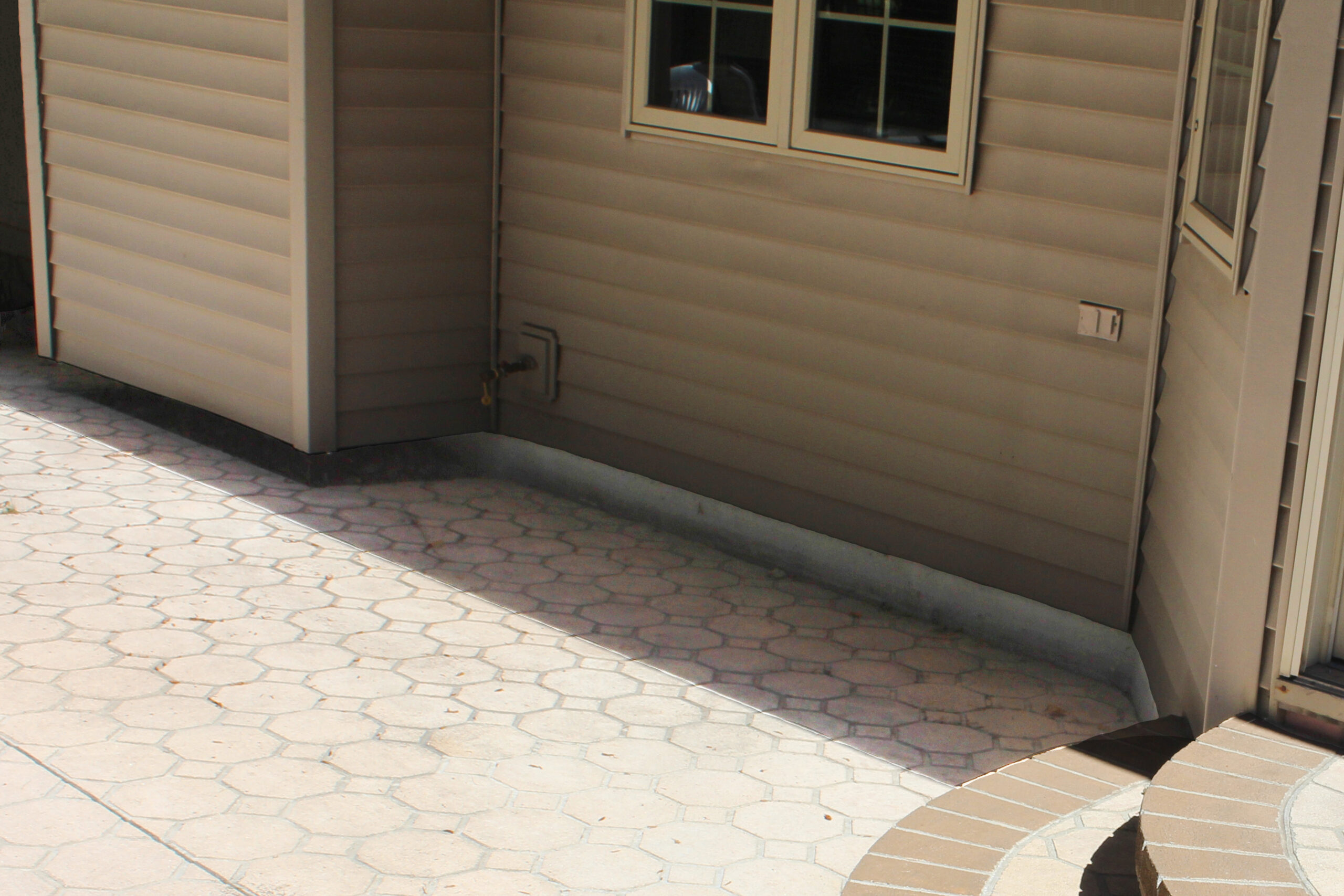 Before backyard patio concrete lifting project