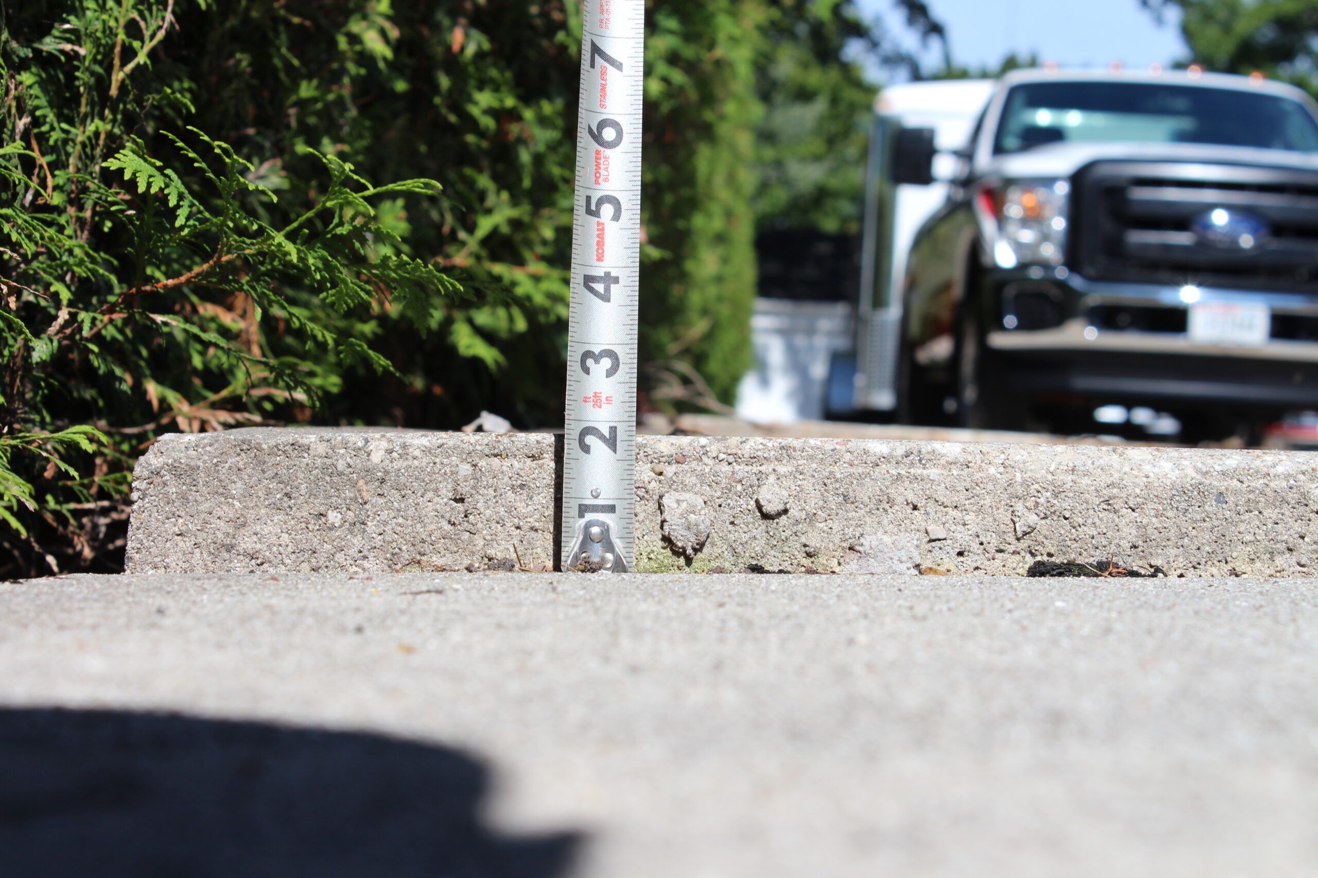 Before residential driveway concrete lifting project