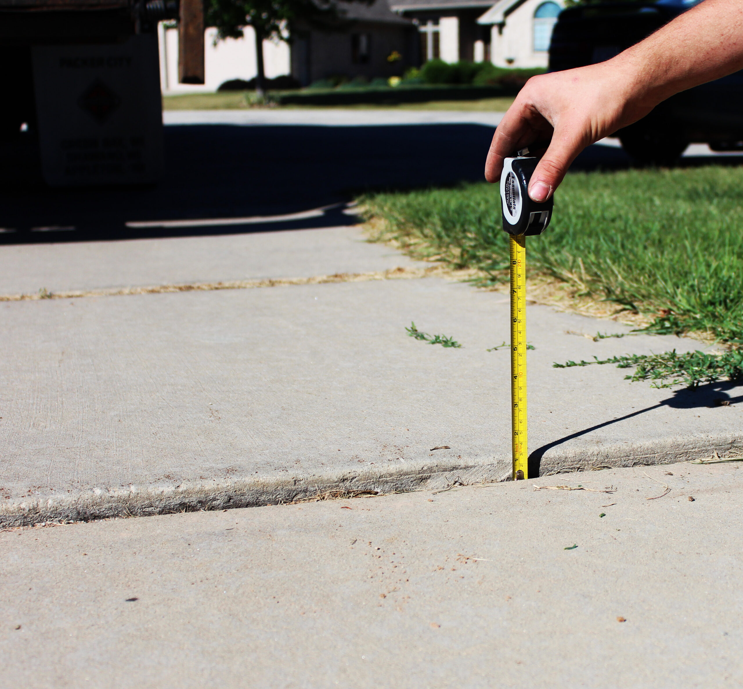 Before uneven sidewalk concrete lifting repair